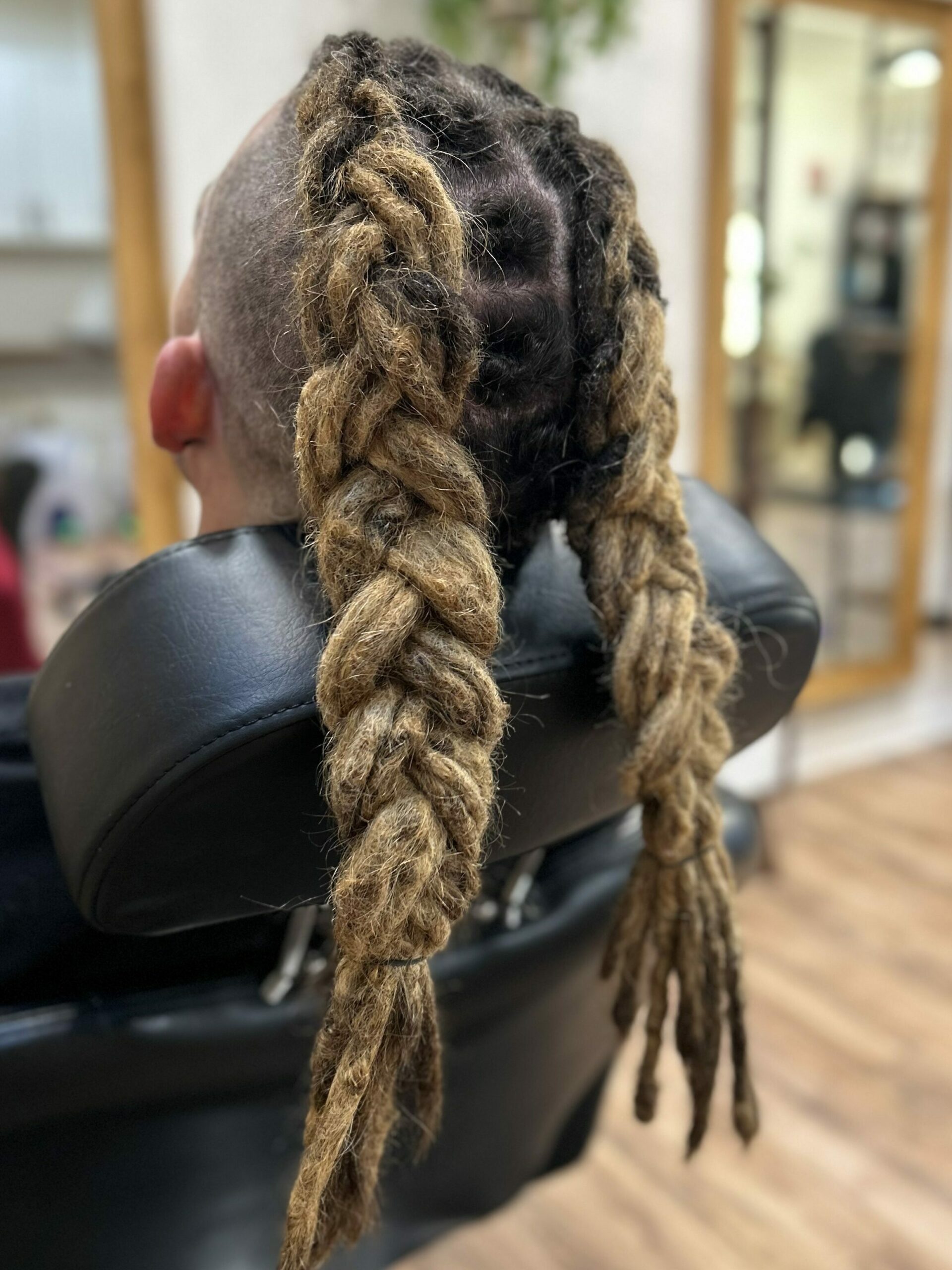 A dreadlock braid style done at a dreadlock maintenance appointment.